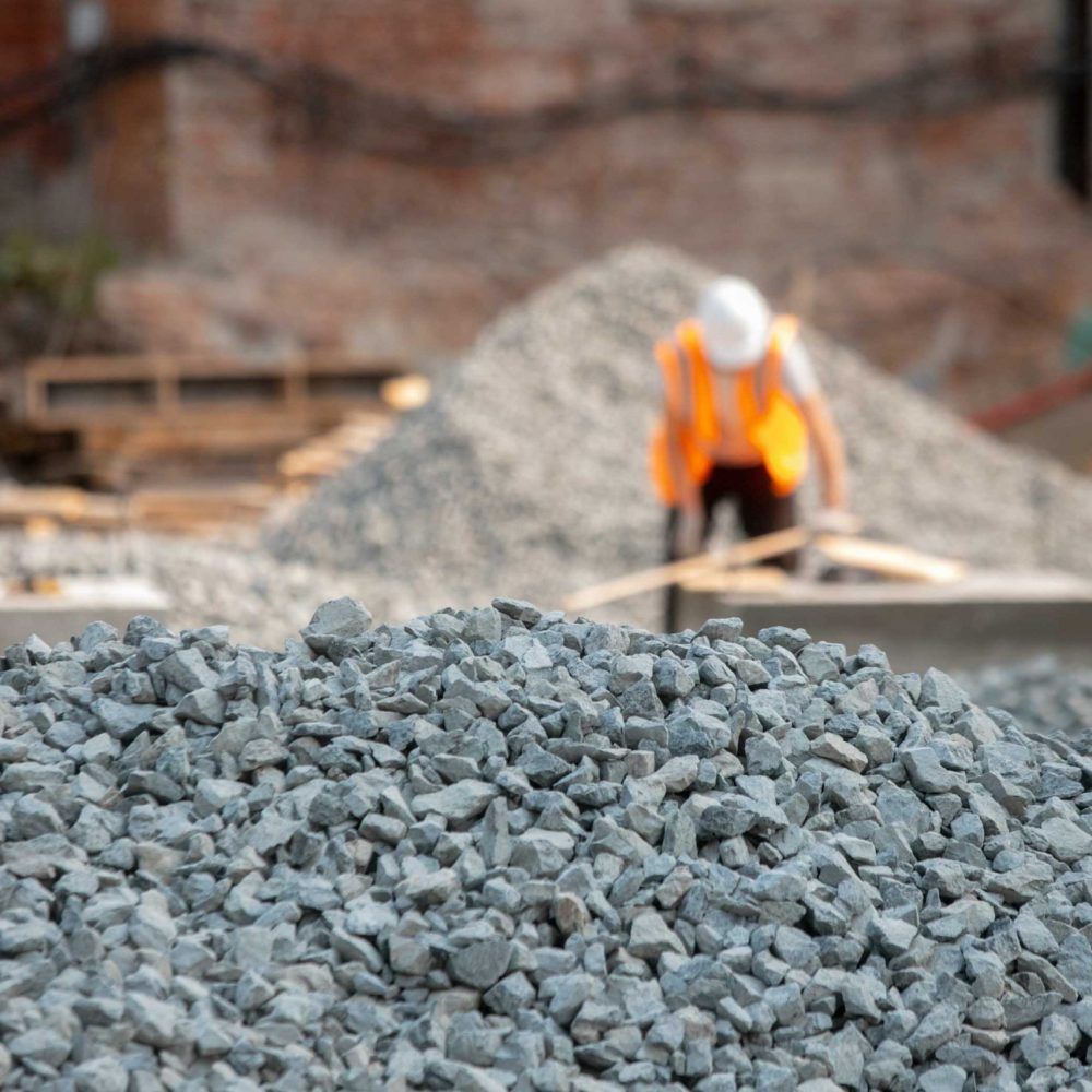 Road construction gravel texture , close up on pile of gravel for construction of a road at a construction site. Road construction background